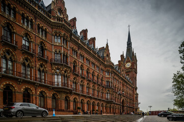 Fototapeta premium A tower of St Pancras International Railway Station against cloudy sky. London, UK.