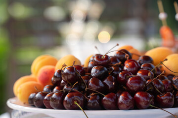 cherries, cherries and fresh apricots on the buffet table, wedding