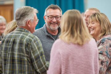 People laughing together at a cheerful community gathering