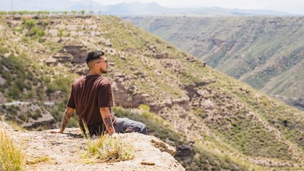 Tourist admiring the landscape of gorafe megalithic park in spain