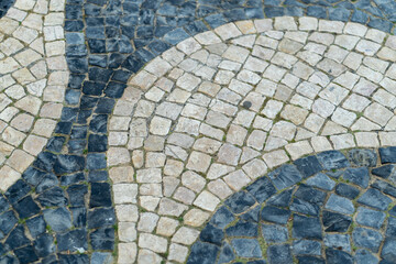 Unique patterns adorn the cobblestone streets of Calcada, Portugal. Traditional stone arrangement...