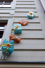 Colorful Present Decoration on a Building Wall Bringing Joy and Festivity to the Urban Environment...