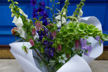 A Stunning Bouquets of Beautiful, Vibrant Flowers Surrounded by Greenery Decoratively Wrapped in...