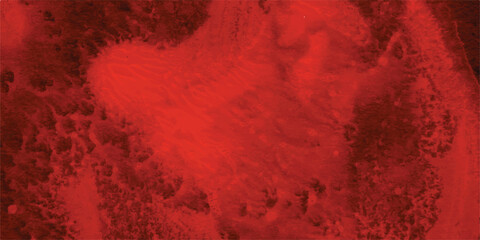 Abstract red watercolor background with textural washes and splatters creating a dramatic and artistic composition suitable for various design projects