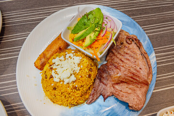Recipe for Moro rice with beef steak, fried plantain and a salad