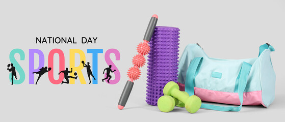 Massage rollers with dumbbells and fitness bag on light background