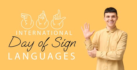 Young deaf mute man on yellow background. Banner for International Day of Sign Languages