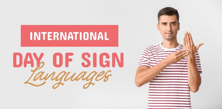 Young deaf mute man on light background. Banner for International Day of Sign Languages