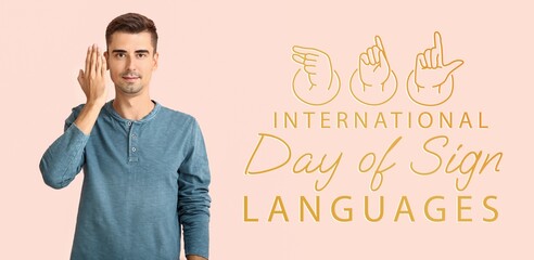 Young deaf mute man on color background. Banner for International Day of Sign Languages