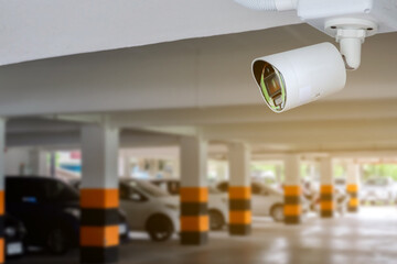 Pixed ip cctv cameras installed on cement pole of parking area of the building, concept for security system of properties by monitoring through CCTV cameras and mobile  devices.