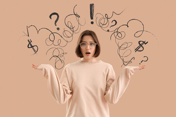 Wondering young woman shrugging on beige background