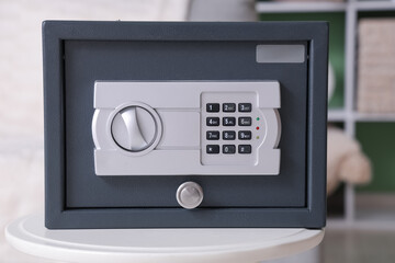 Modern safe on table in living room, closeup