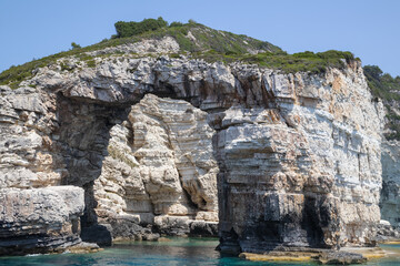 Dramatic Sea Cave and Rugged Cliffs on a Sunny Day