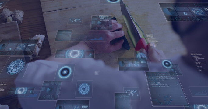 Slicing woman cutting green vegetable using red-handled knife on kitchen bench, with blue holograms - Powered by Adobe