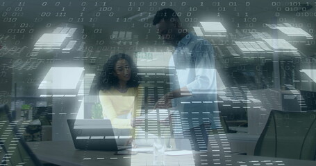 Collaborating woman in yellow top and man reviewing documents and laptop at office, binary overlay