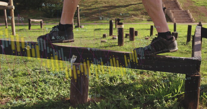 Balancing legs and feet in black athletic shoes on park fitness beam, with digital data overlays - Powered by Adobe
