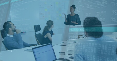 Presenting African American woman gesturing at whiteboard in meeting room, laptops and data overlay