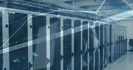 Running server cabinets cooling servers in bright data center aisle, with cable trays
