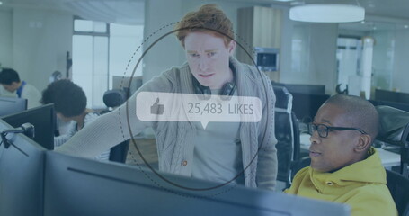 Leaning software engineer showing code to colleague at tech office, with digital likes overlay