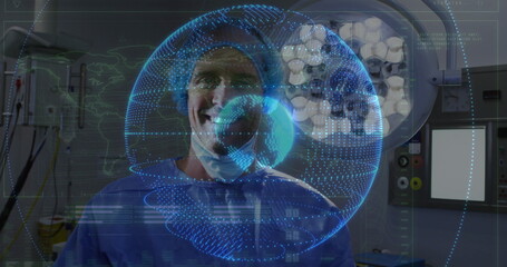 Standing surgeon wearing scrubs cap and mask in operating room, examining digital globe hologram