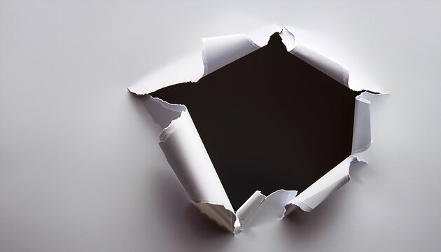 ripped white paper torn hole in white paper sheet