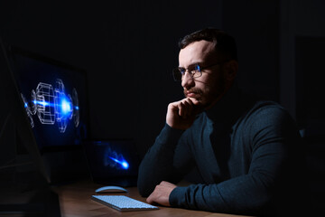 Engineer working with digital drawing at table in office