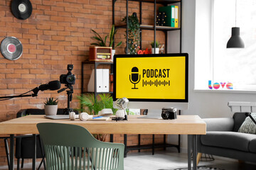 Podcaster's workplace with computer and microphones in studio