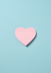 pink heart post-it on a blue background