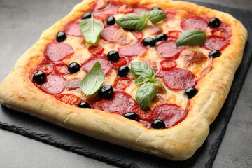 Tasty homemade pizza on grey table, closeup
