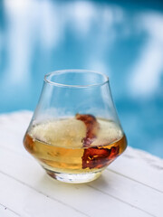 Whiskey with bacon and ice by the poolside: refreshing summer cocktail