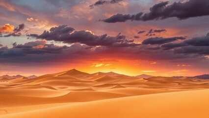 Desert landscape with sand dunes and dramatic sky at sunset