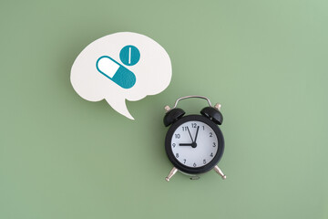 Drugs icons on real white speech bubble paper cut with black analog  clock on green background