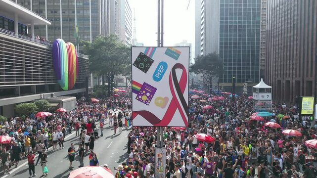 Drone orbiting LGBTQ-themed art exhibit on Avenida Paulista during Pride Parade &ndash; 4K