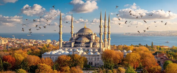 Fototapeta premium Blue Mosque in Istanbul, Turkey Surrounded by Autumn Trees and Birds in Flight