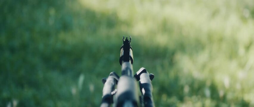 Rifle aimed a shooting range with front sight focused during outdoor training