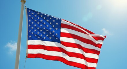 Fototapeta premium American Flag Waving in Sunny Sky