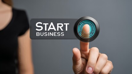 Woman's finger pressing a digital button displaying Start Business technology