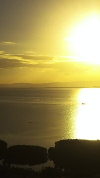 Beautiful scenery of sunset over the sea and mangroves in Olango Island, Lapu-Lapu, Philippines. Vertical view.