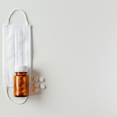 Protective Measures and Medication: Pills, Mask, and Bottle on White Background
