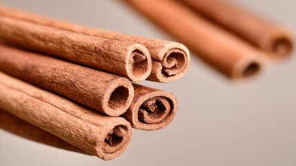 Close-up cinnamon sticks, kitchen counter, blurred background, cooking
