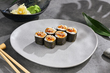 Hosomaki eel sushi with sesame seeds, bright lighting, overhead composition, Japanese restaurant menu