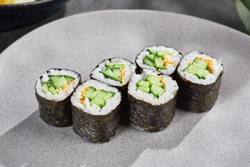 Avocado hosomaki roll, bright lighting, minimal overhead composition