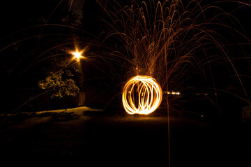 steel wool on fire orb long exposure at night