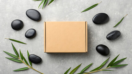 Spa gift box with smooth black stones and greenery