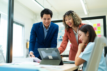 Group of creative Businesspeople brain storm meeting presentation,discussing roadmap to product launch, planning,strategy,dashboard,new business development,working with new startup project in office