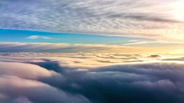 High-altitude view of cloudscapes bathed in golden sunlight