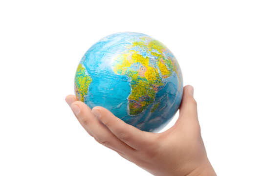 A hand holding a small globe with continents displayed against a black background in studio shot