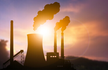 Coal Power Plant Silhouette with Smoke at Sunset