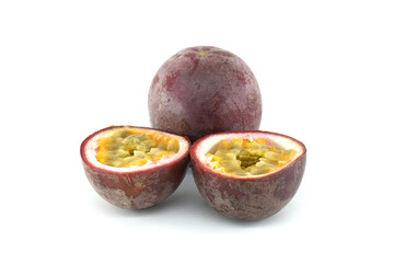 Fresh passion fruits, Passiflora edulis, presenting a whole fruit and two halves showing the pulp and seeds