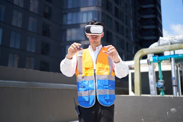 Engineer or worker wearing virtual reality glasses(VR) at urban industrial site